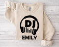 Perfect for DJs, music producers, festival performers and electronic music enthusiasts, this personalised DJ sweatshirt features a bold headphones graphic with your custom DJ name for a professional look. Ideal for gigs, studio sessions and everyday wear, every premium sweatshirt is professionally printed in the UK by TeezoraPrints using high-quality materials for warmth and comfort.