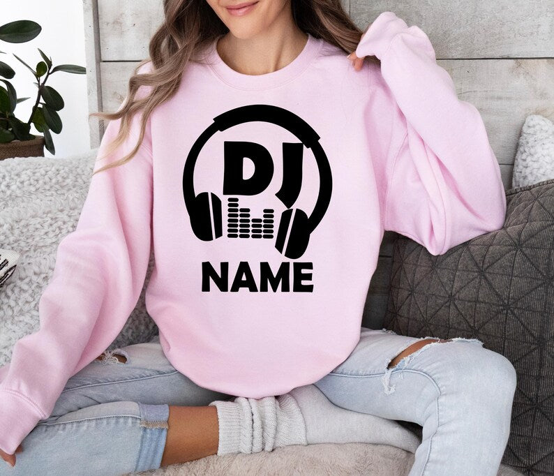 Custom DJ sweatshirt for DJs, music producers, festival performers, nightclub entertainers and electronic music fans. Perfect for live performances, studio recording, rehearsals, festivals and everyday wear. Every premium sweatshirt is professionally printed in the UK by TeezoraPrints, delivering warmth, comfort and vibrant print quality.