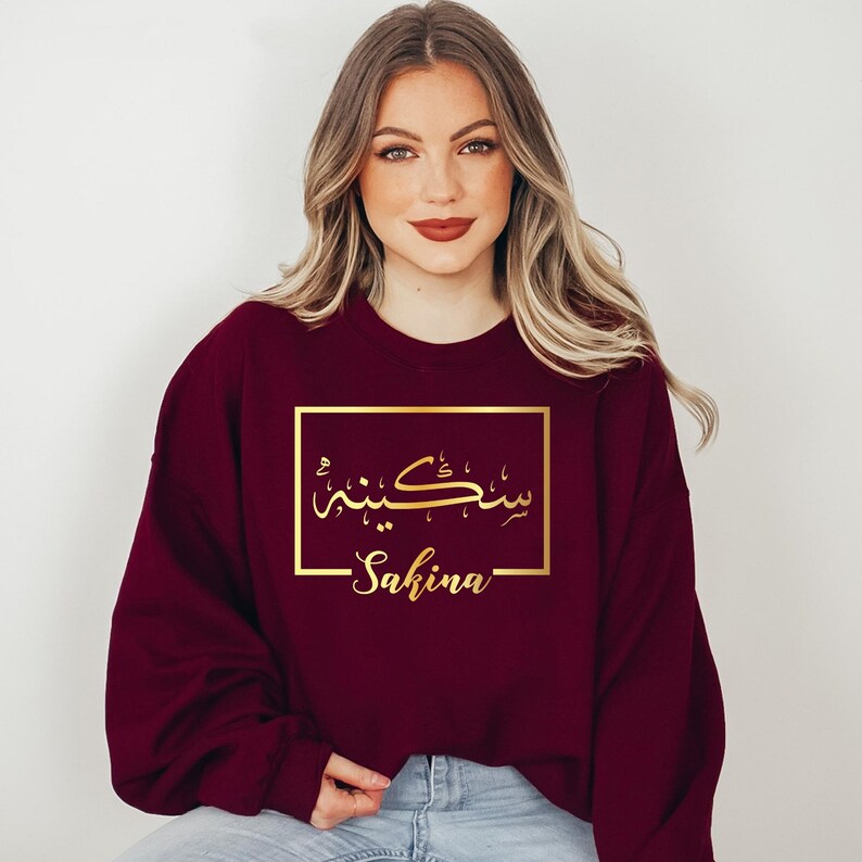 Personalised Arabic Name Sweatshirt celebrating faith, identity, culture, and personal expression through elegant Arabic calligraphy. Featuring your chosen Arabic name printed on a premium sweatshirt, this meaningful design creates a lasting keepsake while combining modest fashion, individuality, comfort, and cultural pride in one stylish personalised garment.