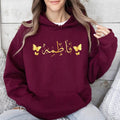 Personalised Arabic Name Hoodie, custom Arabic calligraphy hoodie, butterfly Arabic hoodie, Arabic typography hoodie, personalised Arabic clothing, Islamic fashion hoodie, Muslim women hoodie, Arabic script apparel, butterfly graphic hoodie, custom name hoodie, premium Arabic fashion, personalised Islamic clothing, Arabic name gift, custom Arabic text hoodie, and personalised Muslim fashion with elegant Arabic styling and meaningful custom design.