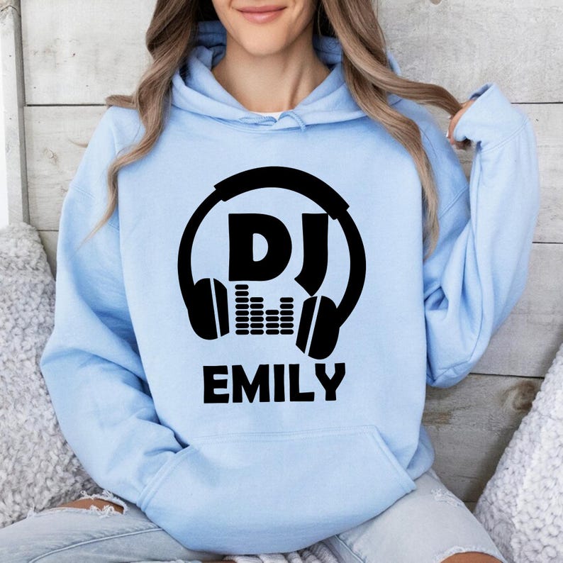 Searching for the perfect gift for a DJ? This personalised DJ hoodie is a thoughtful choice for birthdays, Christmas, Father's Day, Mother's Day or special celebrations. Featuring a custom DJ name with bold headphones artwork, every premium hoodie is professionally printed in the UK by TeezoraPrints for a memorable personalised gift.