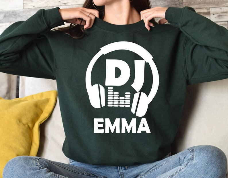 Create a unique personalised DJ sweatshirt by adding your own DJ name beneath the bold headphones design. Perfect for professional DJs, beginners, music producers and festival performers looking for custom apparel. Every sweatshirt is made to order and professionally printed in the UK by TeezoraPrints for exceptional quality and a personalised finish.