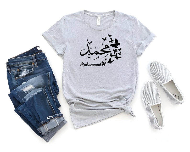 Personalised Arabic Name Butterfly T Shirt gift, custom Arabic calligraphy shirt for women, butterfly Arabic typography tee, personalised Muslim gift, Arabic name clothing, Islamic gift for her, custom Arabic text shirt, personalised Islamic fashion, unique Eid gift, Ramadan gift idea, premium personalised t shirt, and elegant Arabic-inspired fashion.