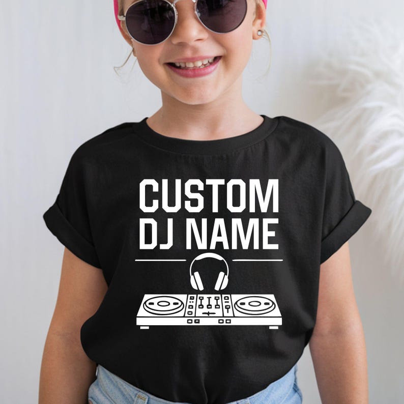 Custom DJ shirt designed for DJs, music producers, EDM artists, festival performers, nightclub entertainers and electronic music fans. Perfect for gigs, live events, club performances, recording studios and music festivals. Every premium graphic t-shirt is professionally printed in the UK by TeezoraPrints, offering outstanding comfort and vibrant print quality.