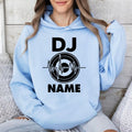 Featuring a bold heartbeat waveform wrapped around a turntable graphic with your personalised DJ name, this premium hoodie delivers a modern music-inspired look. Professionally printed in the UK by TeezoraPrints using high-quality materials for lasting durability.