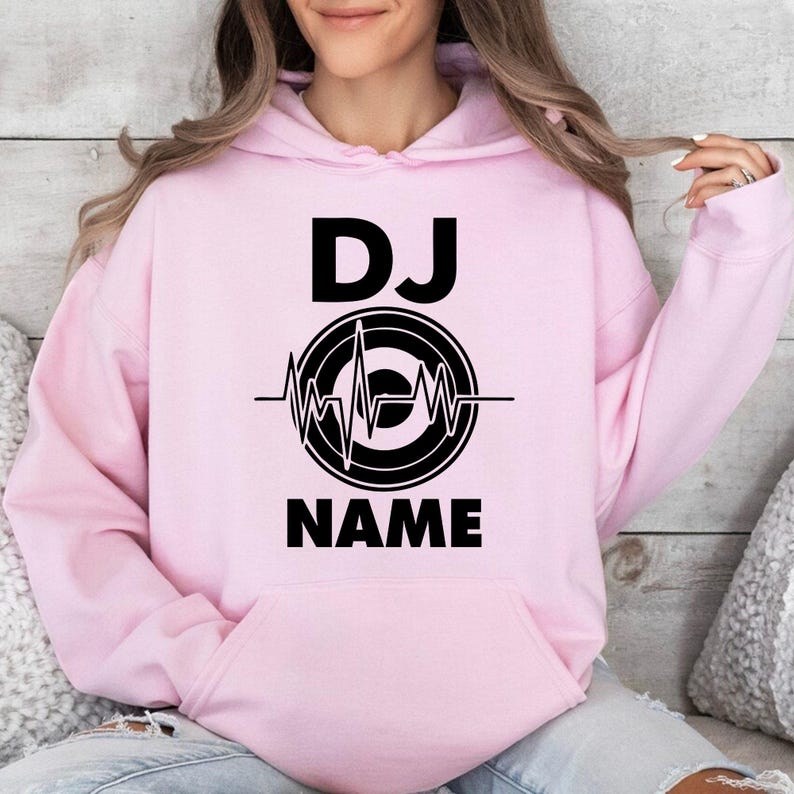 Create a unique personalised DJ hoodie by adding your own DJ name beneath the heartbeat turntable design. Perfect for professional DJs, beginners, producers and entertainers looking for custom apparel. Every hoodie is made to order and professionally printed in the UK by TeezoraPrints.
