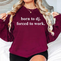 If your heart belongs behind the DJ booth, this Born To DJ. Forced To Work. sweatshirt is made for you. The funny slogan, premium fabric and relaxed unisex fit create the perfect combination of comfort and style for DJs and music lovers. Ideal for performances, festivals, studio sessions or everyday wear. Every sweatshirt is professionally printed in the UK by TeezoraPrints using premium-quality printing techniques.