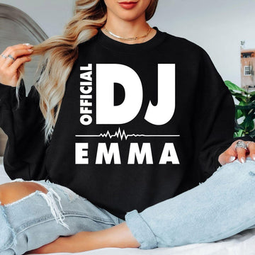 Personalised Official DJ Heartbeat Sweatshirt featuring a custom name, bold Official DJ typography and a heartbeat waveform graphic. Designed for professional DJs, music producers, club performers and electronic music lovers who want to showcase their passion with a personalised premium crewneck. Professionally printed in the UK by TeezoraPrints using high-quality materials for outstanding comfort, durability and everyday style.