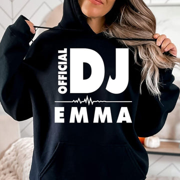 Personalised Official DJ Heartbeat Hoodie featuring a custom name, bold Official DJ typography and a heartbeat waveform graphic. Designed for professional DJs, music producers, club performers and electronic music lovers who want to represent their passion with a premium personalised hoodie. Professionally printed in the UK by TeezoraPrints using high-quality materials for warmth, comfort and long-lasting durability.