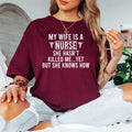Looking for the perfect gift for the husband of a nurse? This My Wife Is A Nurse She Hasn't Killed Me Yet But She Knows How T Shirt from Teezora Prints features a hilarious nursing quote with bold typography and medical symbols that every nursing family will appreciate. Professionally printed on a premium quality unisex t shirt, it's perfect for birthdays, Christmas, Nurse Appreciation Week, hospital events, Father's Day, and thoughtful gifts for nurse families.