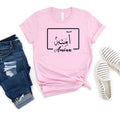 Elegant personalised Arabic name t shirt showcasing a premium gold Arabic calligraphy design positioned within a clean geometric frame. The minimalist layout combines traditional Arabic script with modern typography to create a sophisticated and eye-catching appearance. Printed on a black shirt for maximum contrast and visual impact, the design offers a luxurious aesthetic while maintaining simplicity, making it ideal for lovers of personalised Arabic artwork.