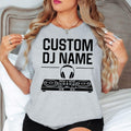 Create a one-of-a-kind DJ shirt by adding your own custom DJ name above the professional controller and headphones design. Perfect for DJs, music producers, entertainers and music lovers wanting personalised apparel. Every shirt is made to order and professionally printed in the UK by TeezoraPrints, ensuring exceptional quality and a unique personalised finish.