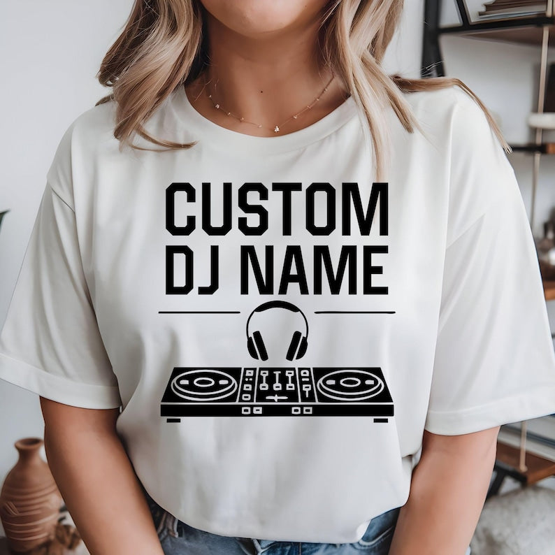 Perfect for DJs, music producers, festival performers and electronic music enthusiasts, this personalised Custom DJ Name shirt features a professional DJ controller and headphones graphic with your custom stage name. Designed for performances, studio sessions and everyday wear, every premium t-shirt is professionally printed in the UK by TeezoraPrints using high-quality materials for exceptional comfort.