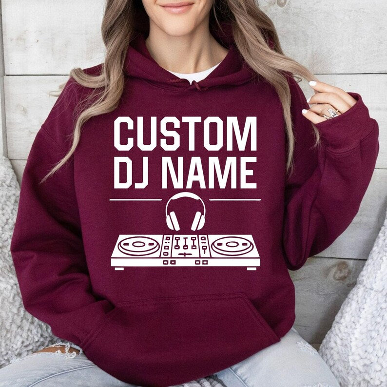 Stand out with this personalised DJ hoodie featuring your custom DJ name and modern controller artwork. Soft premium fabric, relaxed unisex fit and professional printing make it perfect for performances, festivals and daily wear. Every hoodie is made to order and professionally printed in the UK by TeezoraPrints.