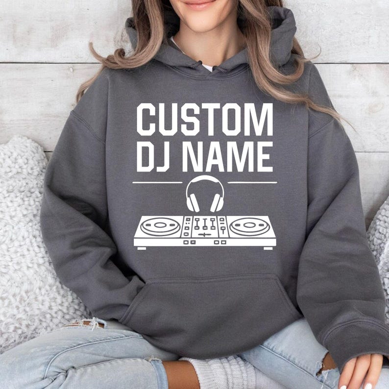 Custom DJ hoodie designed for DJs, producers, EDM artists, club entertainers and festival performers. Perfect for live shows, rehearsals, recording sessions, concerts and everyday outfits. Every premium hoodie is professionally printed in the UK by TeezoraPrints for exceptional comfort and lasting quality.
