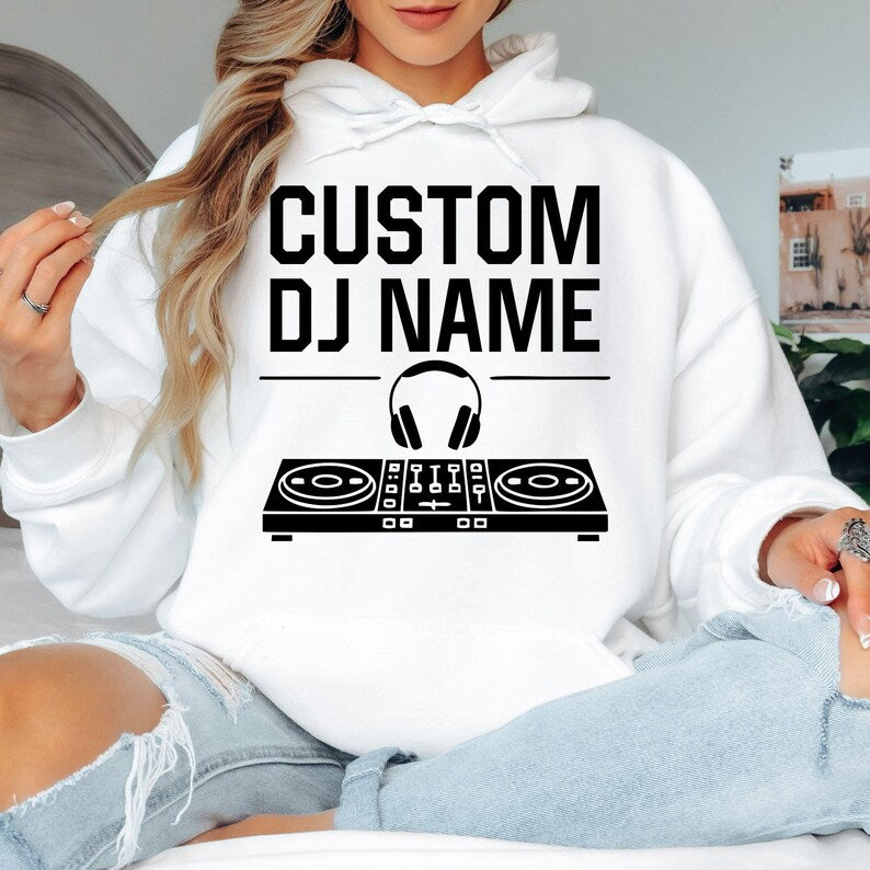 Designed for DJs, producers, festival performers and electronic music lovers, this personalised hoodie features a custom DJ name with a professional controller and headphones graphic. Perfect for performances, studio sessions and everyday outfits, every premium hoodie is professionally printed in the UK by TeezoraPrints using high-quality fabric for lasting comfort.