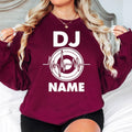 Perform in style with this personalised DJ sweatshirt featuring your custom name and modern heartbeat turntable design. Soft premium fabric, relaxed unisex fit and durable professional printing make it an excellent choice for music lovers. Every sweatshirt is made to order and professionally printed in the UK by TeezoraPrints.
