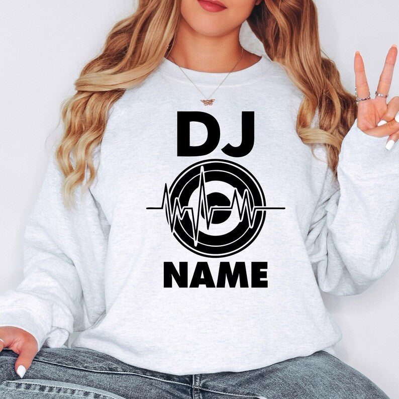 Custom DJ sweatshirt designed for DJs, producers, EDM artists, festival performers and nightclub entertainers. Perfect for live events, rehearsals, studio recording, concerts and everyday outfits. Every premium crewneck is professionally printed in the UK by TeezoraPrints, providing warmth, comfort and vibrant print quality.