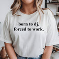 Funny Born To DJ Forced To Work t-shirt featuring a clean typography design for DJs, music producers, disc jockeys, club entertainers and EDM artists. Ideal for music festivals, recording studios, rehearsal sessions, club nights, concerts and casual everyday outfits. This premium unisex graphic tee is professionally printed in the UK by TeezoraPrints, offering exceptional print quality, soft cotton comfort and long-lasting durability for regular wear.