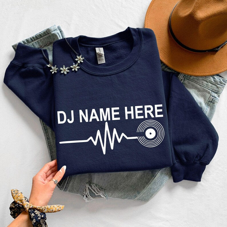personalised DJ sweatshirt, custom DJ name sweatshirt, DJ heartbeat crewneck, vinyl record sweatshirt, music producer jumper, disc jockey sweatshirt, festival sweatshirt, EDM apparel, club DJ clothing, personalised music gift, premium crewneck printed in the UK by TeezoraPrints.