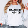 Premium personalised DJ heartbeat sweatshirt featuring custom DJ name, heartbeat waveform and vinyl record artwork. Ideal for club DJs, mobile DJs, music producers, festival performers and electronic music enthusiasts. Printed in the UK by TeezoraPrints.