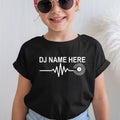 Premium personalised DJ heartbeat shirt featuring custom DJ name, heartbeat waveform and vinyl record artwork. Ideal for club DJs, mobile DJs, music producers, festival performers and electronic music enthusiasts. Printed in the UK by TeezoraPrints.