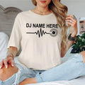 Express your passion for music with this personalised DJ Name Heartbeat T-Shirt featuring a heartbeat waveform connected to a vinyl record. Whether performing behind the decks or relaxing with friends, this premium tee is professionally printed in the UK by TeezoraPrints.
