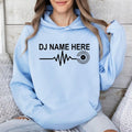 Customise this DJ Name Heartbeat Hoodie with any name to create a unique gift for DJs, music producers and vinyl lovers. Featuring a modern heartbeat graphic and premium-quality printing, every hoodie is professionally printed in the UK by TeezoraPrints.