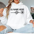 Custom DJ Name Heartbeat Hoodie with personalised name, heartbeat waveform and vinyl record design. Perfect for professional DJs, disc jockeys, music producers, EDM fans and festival lovers. Professionally printed in the UK by TeezoraPrints using premium-quality materials.