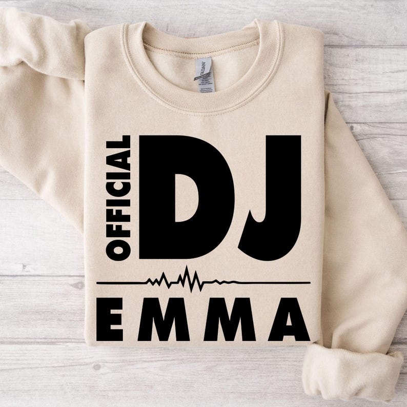 Perfect for DJ performances, nightclub events, music festivals, studio recording sessions, concerts, weekend outings and everyday casual wear. This personalised Official DJ Heartbeat Sweatshirt combines a custom name with a bold heartbeat graphic to create a stylish music-inspired crewneck. Printed in the UK by TeezoraPrints using premium-quality printing.