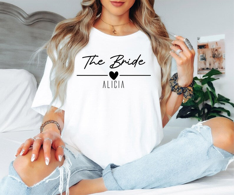Comfortable personalised bridal party shirts suitable for hen weekends, wedding planning events, bridal showers, destination weddings, wedding preparation mornings and casual celebrations. These matching t shirts help create beautiful photographs while keeping the bridal party comfortable throughout the festivities.