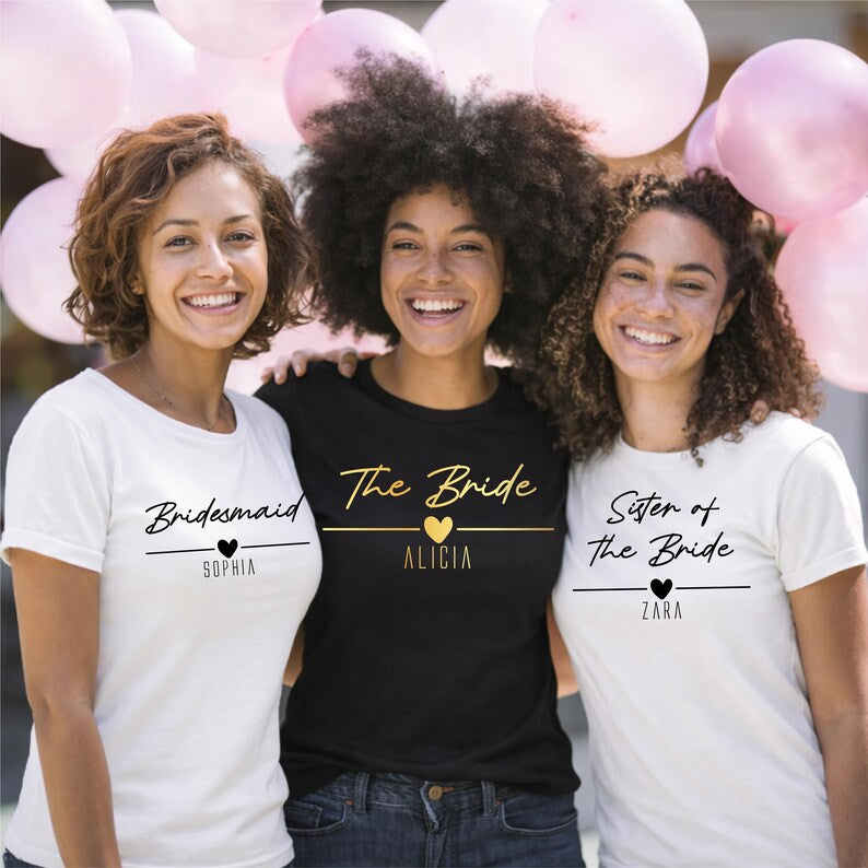Custom bridal party t shirts personalised with individual names and wedding roles. Customers can choose titles such as Bride, Bridesmaid, Maid of Honour, Sister of the Bride, Mother of the Bride and Bride Squad. A personalised wedding clothing option designed to make every member of the bridal party feel special.
