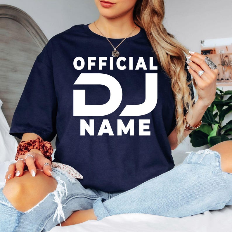 Custom Official DJ shirt for DJs, nightclub performers, music producers, festival artists and entertainment professionals. Perfect for live gigs, recording studios, private events, club performances and music festivals. Every premium graphic t-shirt is professionally printed in the UK by TeezoraPrints for outstanding comfort and vibrant print quality.