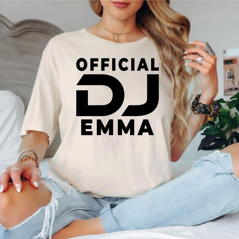 Express your passion for music with this personalised Official DJ shirt featuring your custom stage name in a bold graphic design. Whether you're mixing tracks, producing music, performing live or attending festivals, this premium t-shirt offers comfort and standout style. Every shirt is proudly printed in the UK by TeezoraPrints.