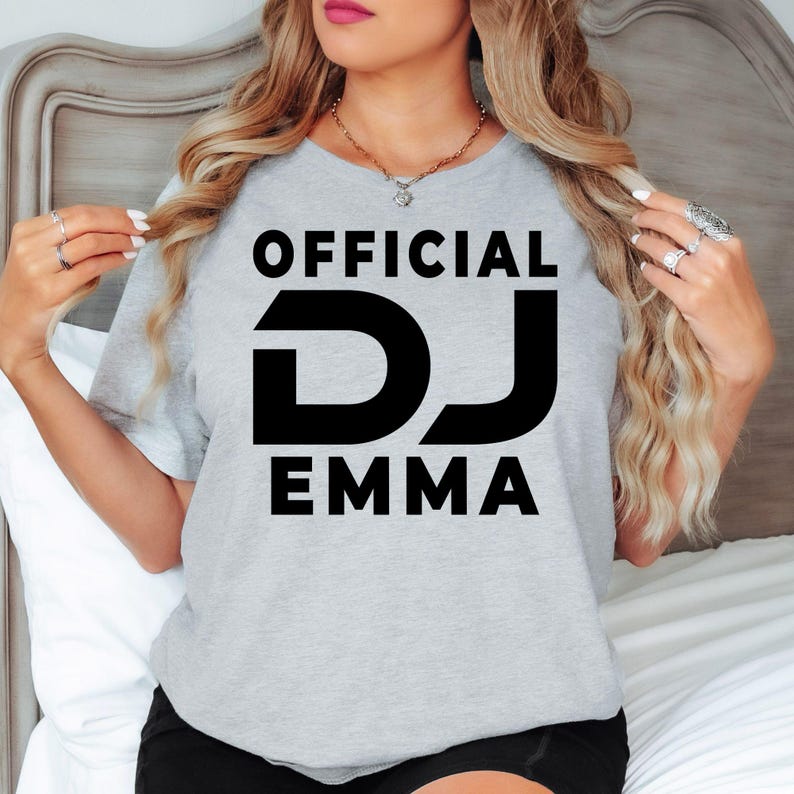 Create a unique personalised Official DJ shirt by adding your own DJ name to this bold graphic design. Ideal for professional DJs, beginners, music producers and entertainers looking for custom apparel. Every order is made to order and professionally printed in the UK by TeezoraPrints, ensuring premium quality and a personalised finish.
