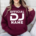 Stand out with this personalised Official DJ hoodie featuring your custom DJ name in a bold eye-catching design. The soft premium fabric, relaxed unisex fit and professional print make it perfect for DJs, performers and music enthusiasts. Every hoodie is made to order and professionally printed in the UK by TeezoraPrints for a premium finish.