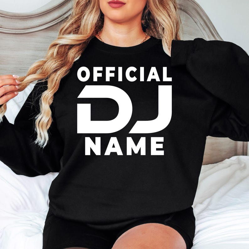 Designed for DJs, music producers, festival performers and electronic music lovers, this personalised Official DJ sweatshirt features your custom DJ name in a bold professional design. Perfect for gigs, studio sessions and everyday wear, every premium crewneck is professionally printed in the UK by TeezoraPrints using premium-quality fabric for exceptional warmth and comfort.