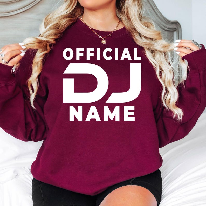 Custom Official DJ sweatshirt designed for DJs, music producers, nightclub entertainers, EDM artists and festival performers. Perfect for studio recording, club nights, rehearsals, music festivals and everyday outfits. Every premium crewneck sweatshirt is professionally printed in the UK by TeezoraPrints, delivering warmth, comfort and outstanding print quality.
