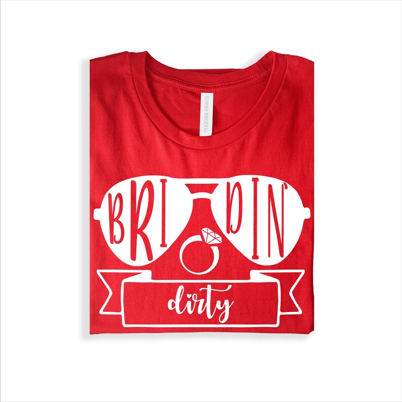 Bride Squad Matching Bachelorette T Shirts make a thoughtful gift for brides, bridesmaids, maid of honour, sisters, cousins, best friends, bridal party members, and wedding planners. Designed by Teezora Prints, this premium matching shirt collection is perfect for bridal showers, hen weekends, engagement parties, wedding mornings, birthdays, girls' holidays, and unforgettable celebrations before the big day.