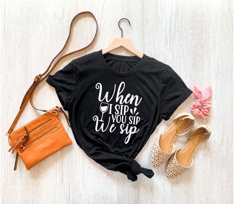 Popular When I Sip You Sip We Sip T Shirt designed for women searching for funny wine shirts, matching girls trip outfits, hen party clothing, bridesmaid shirts, bridal squad apparel, winery T Shirts, birthday party tops and friendship graphic tees. Printed by Teezora Prints, this premium UK-made shirt offers lasting comfort, vibrant print quality and unique style for every celebration.