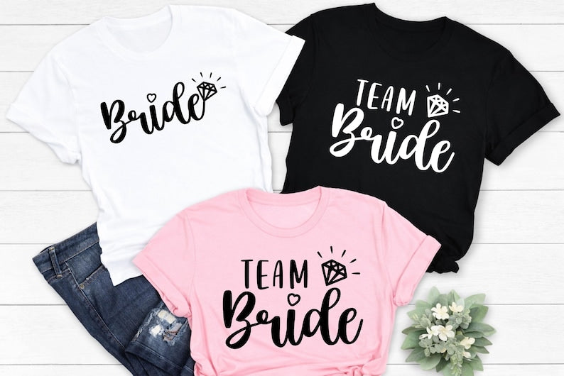 Personalised Team Bride shirt designed for brides, bridesmaids, maid of honour and every member of the bridal party. Featuring elegant script lettering with a sparkling engagement ring, this stylish bridal t-shirt is perfect for creating coordinated wedding outfits and memorable celebrations. Every shirt is professionally printed in the UK by TeezoraPrints using premium cotton for exceptional comfort and long-lasting quality.