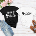 Team Bride shirt, Bride Tribe shirt, personalised bride shirt, bridesmaid t shirt, bridal shower tee, hen party shirt, bachelorette shirt, wedding morning outfit, matching bridal shirts, bridal party clothing and custom wedding apparel. Carefully produced by TeezoraPrints with premium printing and soft cotton fabric for comfortable everyday wear.