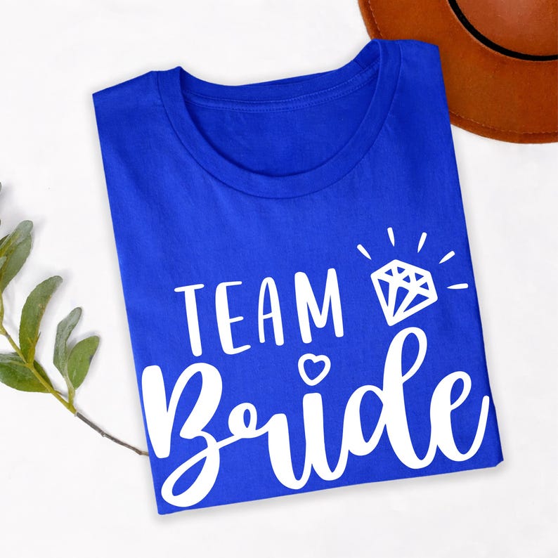 Customise your bridal party with matching Team Bride shirts created for every wedding role. Pair this elegant design with Bride, Bridesmaid, Maid of Honour or other personalised titles to create a coordinated wedding collection. Every shirt is made to order and professionally printed in the UK by TeezoraPrints, delivering premium quality and a truly personal finishing touch.