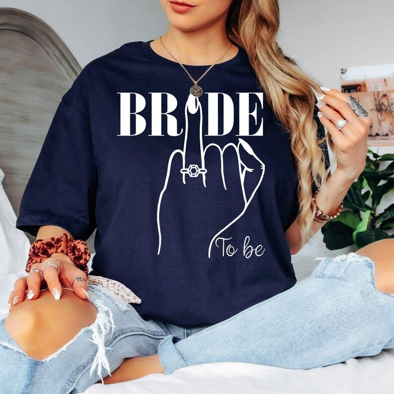 Bride To Be shirt, Future Mrs shirt, bride t shirt, bridal shower tee, engagement shirt, wedding morning shirt, bride gift, bridal outfit, engagement party clothing, wedding celebration apparel and bridal keepsake. This elegant bridal design is professionally printed in the UK by TeezoraPrints for exceptional quality, comfort and style.