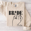 Looking for a thoughtful engagement gift? This Bride To Be sweatshirt is a meaningful keepsake for brides, fiancées and future wives celebrating their special journey. The elegant bridal illustration makes it a stylish gift for bridal showers, engagement celebrations and wedding preparations. Every sweatshirt is printed in the UK by TeezoraPrints using premium materials.