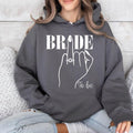 Perfect for bridal showers, engagement parties, hen weekends, wedding mornings, bridal brunches, rehearsal dinners, honeymoon trips, wedding planning days and engagement photoshoots. This Bride To Be hoodie combines warmth, elegance and premium craftsmanship, with every order proudly printed in the UK by TeezoraPrints for lasting quality and comfort.