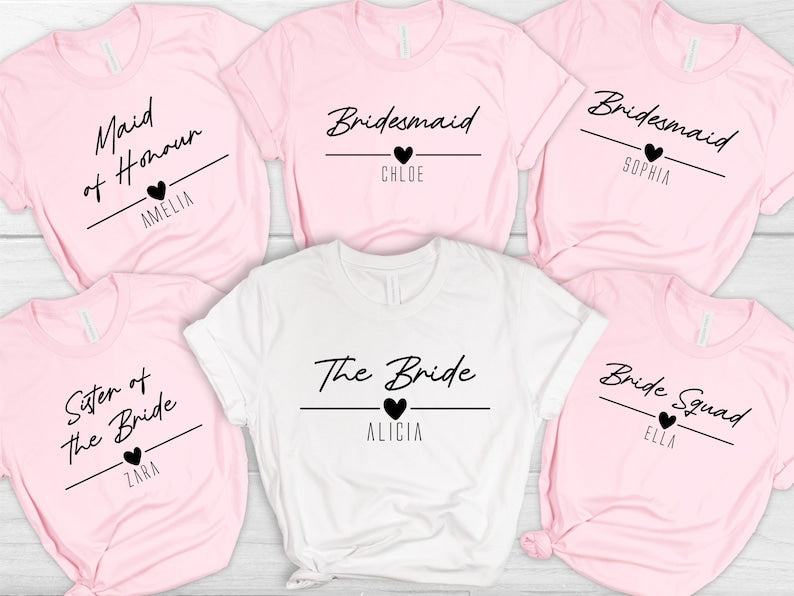 Personalised bridesmaid t shirts featuring custom names and bridal party roles including Bride, Bridesmaid, Maid of Honour, Sister of the Bride and Bride Squad. These matching bridal party shirts are professionally printed for weddings, hen parties and bridal celebrations. Perfect for creating coordinated outfits and memorable wedding keepsakes.