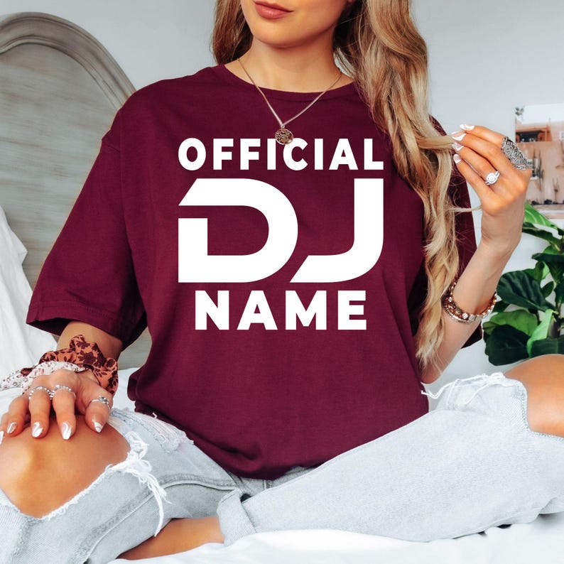 Perform with confidence wearing this personalised Official DJ shirt featuring your custom DJ name in a bold professional design. The relaxed unisex fit and premium cotton fabric make it perfect for long sets, festivals and studio sessions. Every shirt is made to order and professionally printed in the UK by TeezoraPrints for exceptional quality.