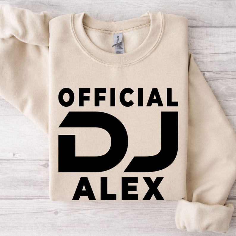 Designed for DJs, music producers, festival performers and electronic music lovers, this personalised Official DJ sweatshirt features your custom DJ name in a bold professional design. Perfect for gigs, studio sessions and everyday wear, every premium crewneck is professionally printed in the UK by TeezoraPrints using premium-quality fabric for exceptional warmth and comfort.