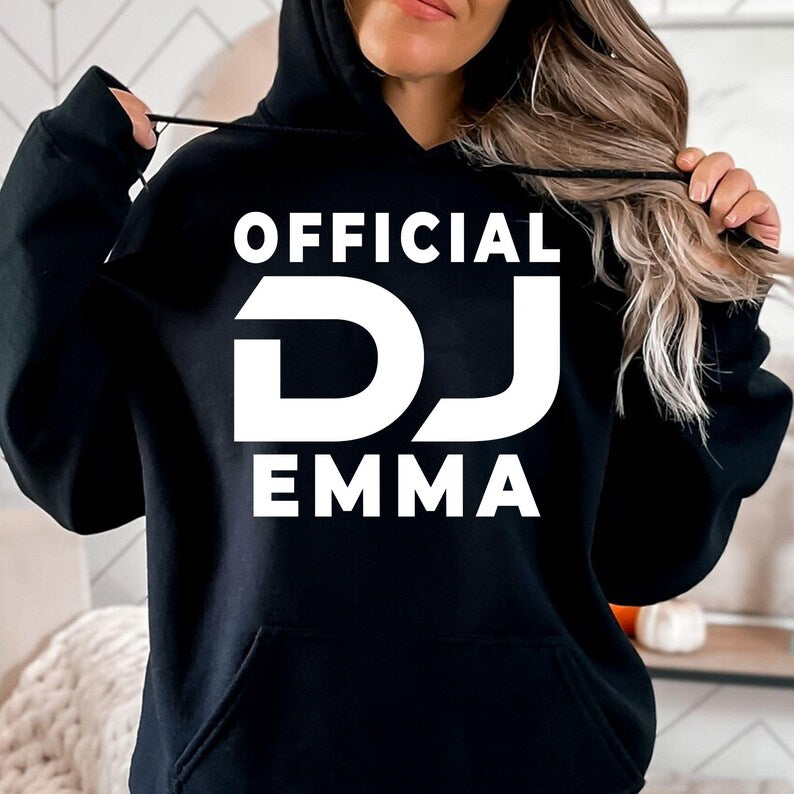 Designed for DJs, music producers, festival performers and electronic music lovers, this personalised Official DJ hoodie features your custom DJ name in a bold modern design. Perfect for live performances, studio sessions and casual everyday wear, every premium hoodie is professionally printed in the UK by TeezoraPrints using high-quality materials for warmth, comfort and durability.